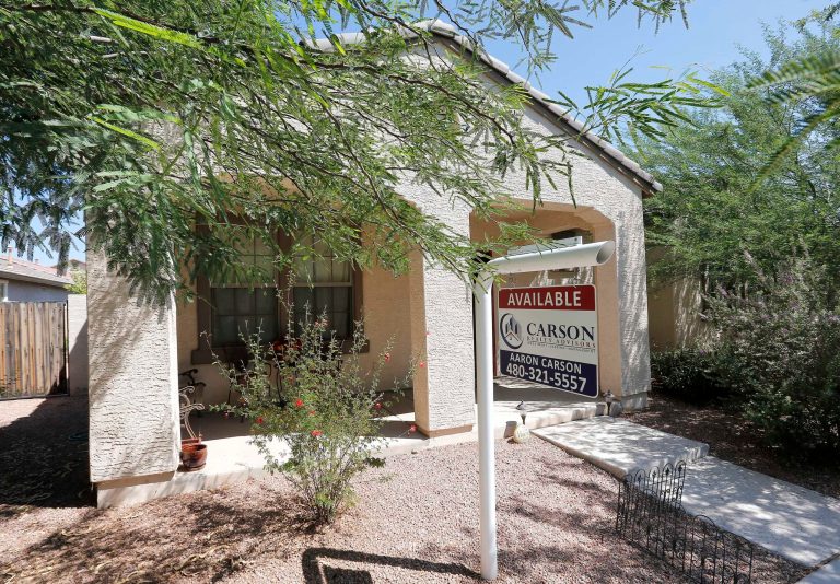   FILE - In this Tuesday, July 30, 2013, file photo, a realty sign hangs in front of a home for sale in Gilbert, Ariz. Freddie Mac reports on mortgage rates for the past week on Thursday, Aug. 8, 2013. (AP Photo/Matt York, File)  