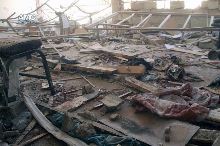 This photo provided by the anti-government activist group Aleppo Media Center (AMC), which has been authenticated based on its contents and other AP reporting, shows a damaged school that was hit by a Syrian government air strike in Aleppo, Syria, Wednesday, April 30, 2014. Many people were killed and wounded, including several children, activists reported. (AP Photo/Aleppo Media Center AMC)