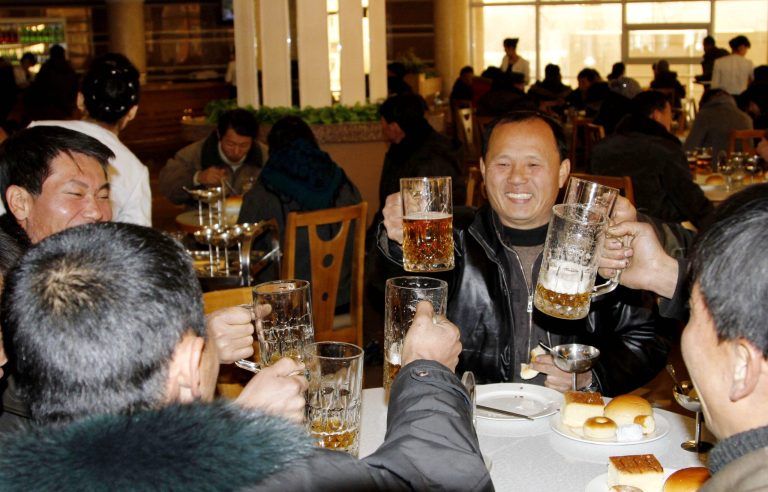   North Koreans toast with beer after hearing the news of a rocket launch at the newly-built Mansukyo Restaurant Wednesday, Dec. 12, 2012 in Pyongyang, North Korea. North Korea appeared to successfully fire a long-range rocket Wednesday, defying international warnings as the regime of Kim Jong Un pushes forward with its quest to develop the technology needed to deliver a nuclear warhead. (AP Photo/Kim Kwang Hyon)  