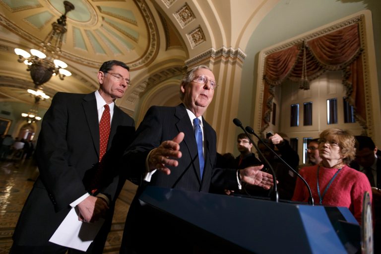 Senate Minority Leader Mitch McConnell, R-Ky.,  joined by Sen. John Barrasso, R-Wyo., left, the Republican Policy Committee chairman, tells reporters that Senate Majority Leader Harry Reid, D-Nev., and his political tactics are almost entirely responsible for making the Senate dysfunctional, following a procedural vote on legislation to renew jobless benefits for the long-term unemployed, at the Capitol. (AP/J. Scott Applewhite)