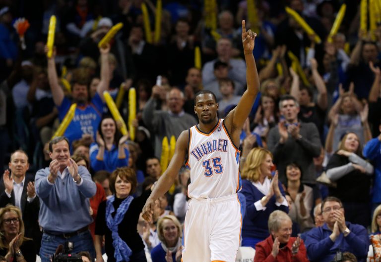   Oklahoma City Thunder forward Kevin Durant (35) and the crowd react to a dunk by Durant against the San Antonio Spurs in the fourth quarter of an NBA basketball game in Oklahoma City, Monday, Dec. 17, 2012. Oklahoma City won 107-93. (AP Photo/Sue Ogrocki)  
