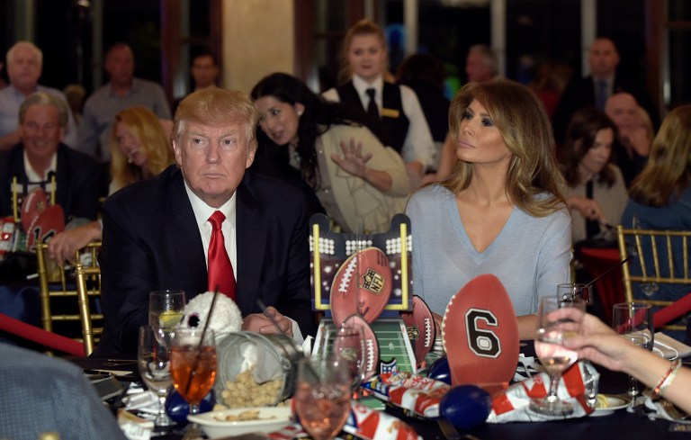 President Trump and first lady Melania Trump attend a Super Bowl party at Trump International Golf Club in West Palm Beach, Fla. Trump congratulated the New England Patriots moments after the team's stunning comeback in the Super Bowl. (AP Photo/Susan Walsh)