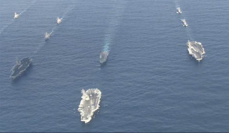 The three aircraft carrier strike forces are training together until Tuesday. (Image courtesy screenshot)