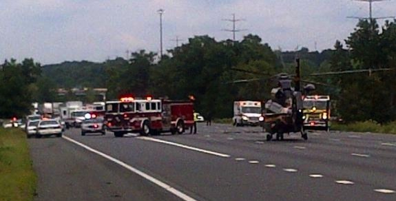 A 23-year-old Prince Georgeâs County Police officer died and another officer was injured when a patrol car drove off Interstate 95 near Powder Mill Road during a pursuit Monday. (Photo courtesy of Prince George's fire and emergency services)
