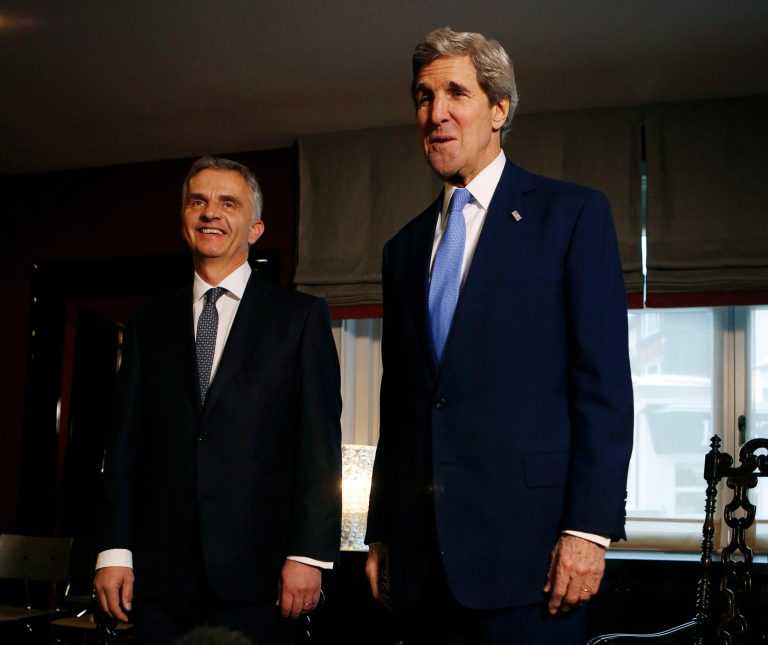 U.S. Secretary of State John Kerry, right, poses with Swiss President Didier Burkhalter for photographers in Davos, Switzerland, Friday, Jan. 24, 2014. Kerry is attending the annual World Economic Forum meeting in the Swiss Alps. (AP Photo/Gary Cameron, Pool)