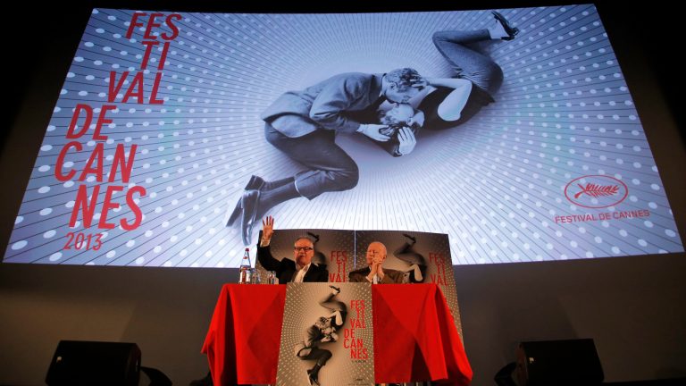 President of the Cannes Film Festival Gilles Jacob, right, and artistic Director Thierry Fremaux, attend a news conference to announce this 2013 festival line up in front of the Cannes International Film Festival poster for the upcoming 66th edition featuring U.S. actors Paul Newman and Joanne Woodward, in Paris, Thursday April 18, 2013. The festival will run from May 15 to May 26, 2013. (AP Photo/Francois Mori)