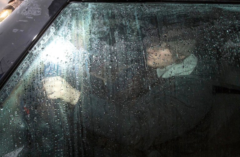 Amanda Knox co-defendant Raffaele Sollecito leaves the Udine police station, northern Italy, Friday, Jan 31, 2014. Police on Friday found Amanda Knox's ex-boyfriend near Italy's border with Slovenia and Austria, hours after he and the American student were convicted for a second time in the death of British student Meredith Kercher. They brought him to the Udine police station, took his passport and put a stamp in his Italian identity papers showing that he cannot leave the country, as mandated by the appeals court in Florence. (AP Photo/Paolo Giovannini)