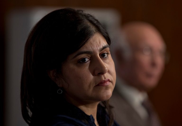 FILE - This is a Thursday, Oct. 3, 2013 file photo of Baroness Sayeeda Warsi, British senior minister of state at the Foreign and Commonwealth Office, listens to a reporter during a joint news conference with Sartaj Aziz in Islamabad, Pakistan.  Britain's  first female Muslim Cabinet member Sayeeda Warsi has resigned in protest of British government policies on Gaza.Sayeeda Warsi, a Foreign Office minister, says that she wrote to Prime Minister David Cameron on Tuesday Aug. 5, 2014 saying she could 