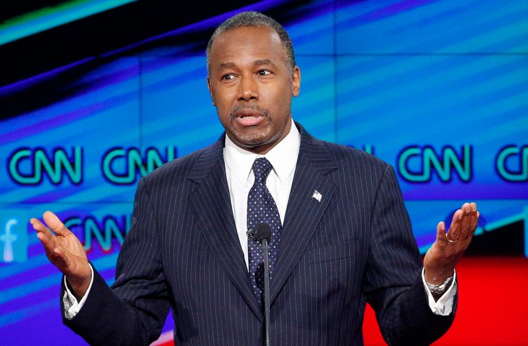 Republican presidential candidate Ben Carson's tax proposal calls for a 14.9 percent flat tax on income of those earning above 150 percent of the Federal Poverty Line. (AP Photo/John Locher)