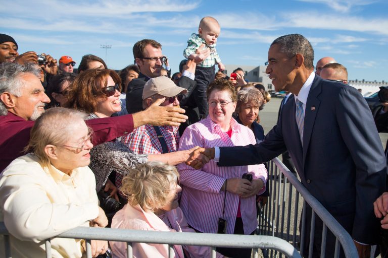 President Barack Obama greets supporters after arriving at San Francisco International airport in San Francisco. (AP/Evan Vucci)