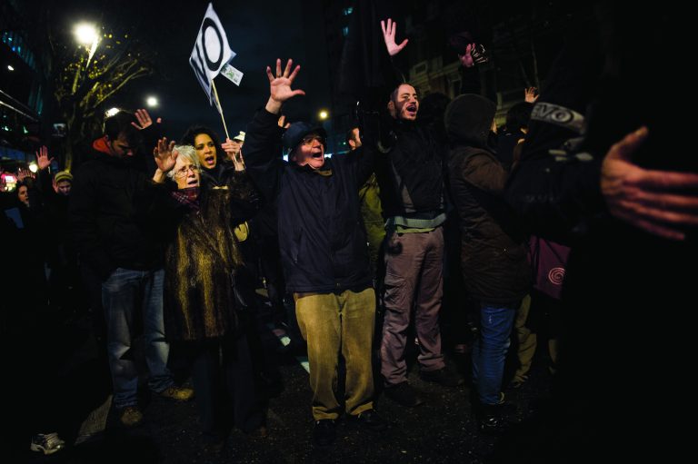 People protest against corruption outside the Popular Party's headquarters in central Madrid, Friday, Jan. 18, 2013. A former Spanish ruling party treasurer amassed 22 million euro ($29 million) in Swiss bank accounts, a court said, prompting a barrage of questions Friday about whether senior officials may have been involved in alleged corruption before taking power in 2011.(AP Photo/Daniel Ochoa de Olza)