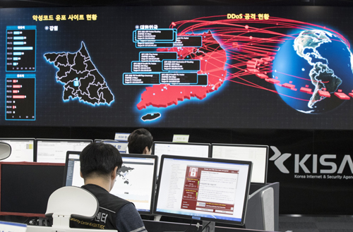 In this Monday, May 15, 2017, file photo, employees watch electronic boards monitoring possible ransomware cyberattacks at the Korea Internet and Security Agency in Seoul, South Korea. Beyond the frequently used shorthand that North Korea was behind the 