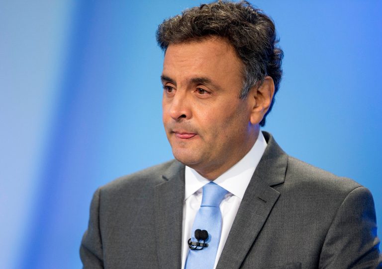 Aecio Neves, presidential candidate of the Brazilian Social Democracy Party, PSDB, looks on during a presidential debate in Sao Paulo, Brazil, Sunday, Oct. 19, 2014. Neves will face Brazil's President Dilma Rousseff, presidential candidate for re-election of the Workers Party, PT, in a presidential runoff on Oct. 26. (AP Photo/Andre Penner)