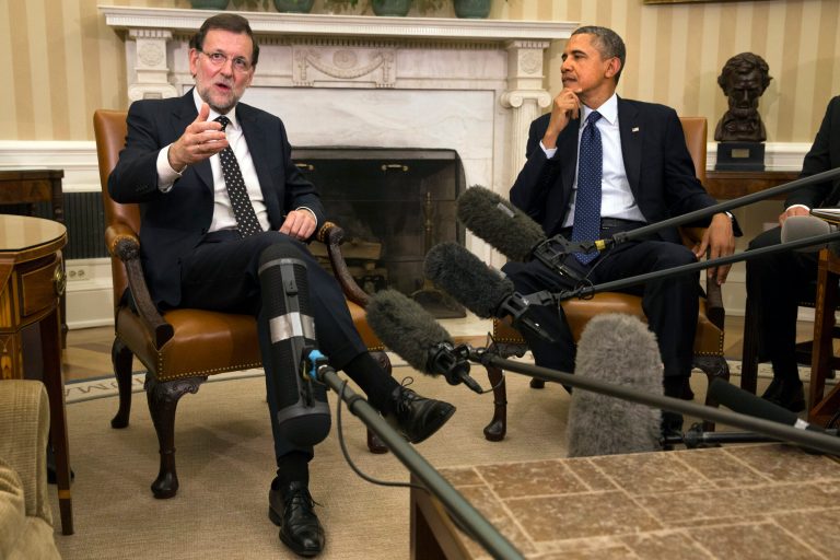Spanish Prime Minister Mariano Rajoy, left, speaks as he meets with President Barack Obama in the Oval Office of the White House in Washington, Monday, Jan. 13, 2014. (AP Photo/Jacquelyn Martin)