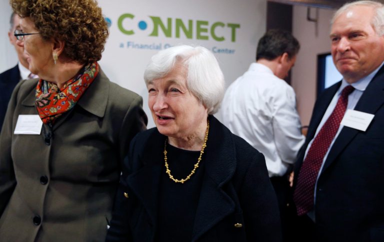 Federal Reserve Chairman Janet Yellen, center, arrives at the office of CONNECT, a coalition of local organizations that provides employment services in Chelsea, Mass., escorted by  Executive Director of The Neighborhood Developers Ann Houston, left, and President and CEO of the Federal Reserve Bank of Boston Eric Rosengren. right, Thursday, Oct. 16, 2014. (AP Photo/Michael Dwyer)