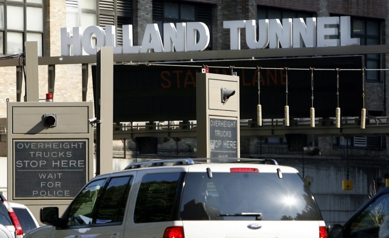 Authorities told NBC 4 New York that two men in their 50s and a woman in her 20s were stopped on the New Jersey side of the Hollan Tunnel around 8 a.m. (AP Photo)