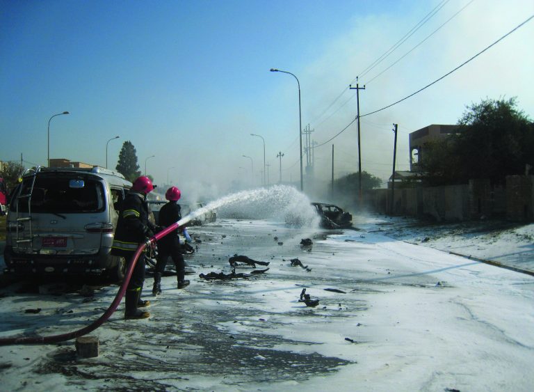 Iraqi firefighters hose down burned cars after a car bomb attack in Kirkuk, 180 miles (290 kilometers) north of Baghdad, Iraq, Monday, Oct. 15, 2012. Three people including two soldiers died and several others were wounded Monday in three attacks two car bombings and a shooting at a checkpoint in and around the city of Kirkuk, home to a combustible mix of Kurds, Sunni Arabs and Turkomen who all claim rights to the city. (AP Photo/Emad Matti)