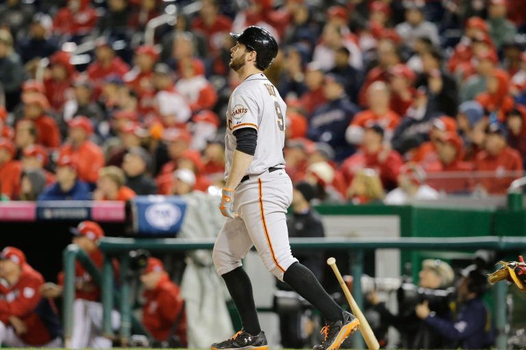 San Francisco Giants' Brandon Belt watches his solo home run in the 18th inning of Game 2 of baseball's NL Division Series against the Washington Nationals in Nationals Park, Saturday, Oct. 4, 2014, in Washington. (AP Photo/Patrick Semansky)