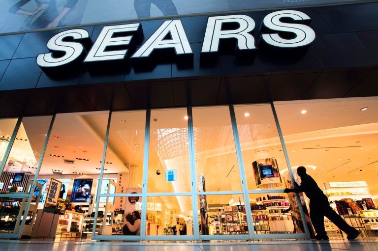 FILE - In this Oct, 29, 2013 file photo, the Sears store at Eaton Centre in Toronto opens its doors for business. Sears is considering selling its Canadian operations as the retailer continues with efforts to turnaround its business. Its stock rose more than 7 percent in premarket trading on Wednesday, May 14, 2014. (AP Photo/The Canadian Press, Frank Gunn, File)