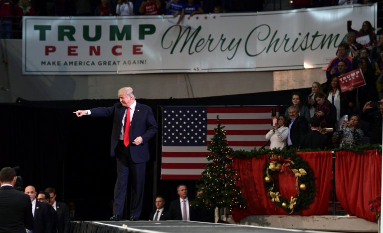 President Donald Trump walks onto the stage to speak at a campaign-style rally at the Pensacola Bay Center, in Pensacola, Fla., Friday, Dec. 8, 2017. (AP Photo/Susan Walsh)