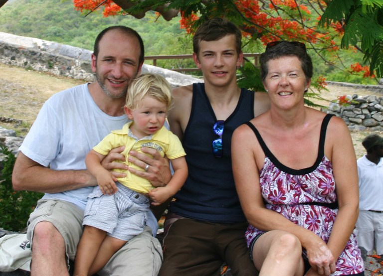   In this June 2008 photo courtesy of the D'Jamoos family, Alexander D'Jamoos, center, poses with his adoptive parents, Michael and Helene D'Jamoos, and his younger brother, Marc, while on a family vacation in the U.S. Virgin Islands. Alexander, who was born with no legs, grew up in a Russian orphanage and was adopted after he came to a Texas hospital to have a prosthesis attached that enabled him to walk. He is angry over legislation pending in Moscow that would ban adoptions of Russian children by Americans. (AP Photo/Family photo, Sasha D'jamoos)  