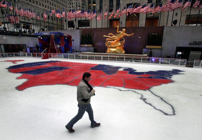 The ice skating rink in New York's Rockefeller Center shows the results of the 2012 presidential election, with states divided into red and blue. (AP Photo/Richard Drew)