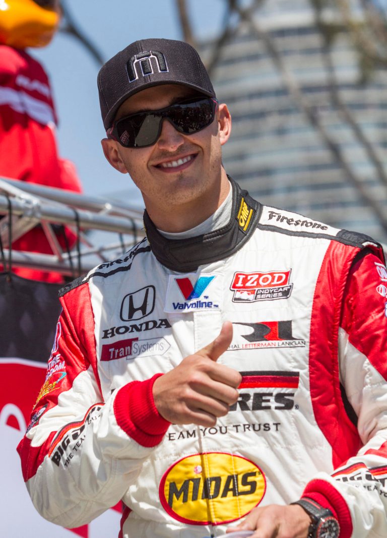 FILE - In this April 21, 2013 file photo, Graham Rahal (15) gestures at the Indy Car Series' Grand Prix of Long Beach auto race in Long Beach, Calif. The long battle between Rahal Letterman Lanigan Racing and Panther Racing for Army National Guard sponsorship ended Thursday, Feb. 6, 2014,with the coveted funding moving to Graham Rahal's car for the upcoming IndyCar season. (AP Photo/Ringo H.W. Chiu, File)