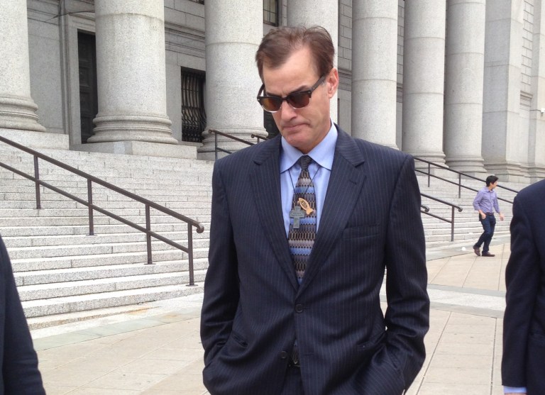 Michael Lucarelli walks away from federal court in Manhattan after pleading guilty to an insider trading charge Wednesday, Sept 24, 2014, in New York. Sentencing was set for Jan. 8. Lucarelli's exit contrasted with his attempt to flee photographers only weeks earlier after his arrest, when he ran out of his sandals as he raced down a sidewalk in slacks and a tank top.  (AP Photo/Larry Neumeister)