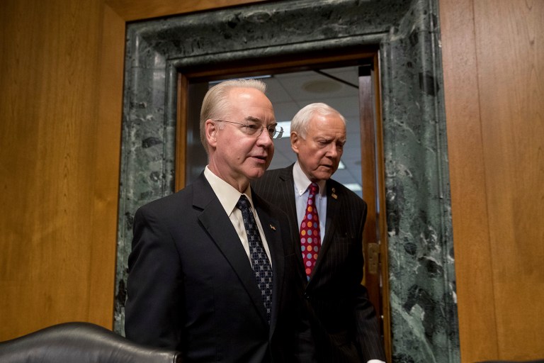 Senate Finance Committee Chairman Sen. Orrin Hatch, R-Utah, right, escorts Health and Human Services Secretary-designate, Rep. Tom Price, R-Ga., on Capitol Hill in Washington, Tuesday, Jan. 24, 2017, prior to the start of the committee's confirmation hearing for Price. (AP Photo/Andrew Harnik)
