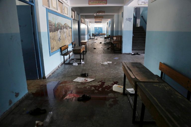 FILE - In this Thursday, July 24, 2014, file photo, blood and and discarded belongings are left behind at a U.N. school in Beit Hanoun, in the northern Gaza Strip. Israeli tank shells hit the compound, killing more than a dozen people and wounding dozens more who were seeking shelter from fierce clashes on the streets outside, Palestinian officials said, as Israel pressed forward with its 17-day war against the territory's Hamas rulers. (AP Photo/Adel Hana, File)