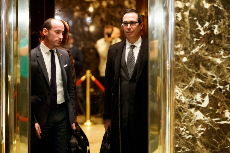 Steve Mnuchin, a potential pick to serve as Treasury Secretary, right, and Stephen Miller, a policy adviser to President-elect Donald Trump get on an elevator at Trump Tower, Monday, Nov. 28, 2016, in New York. (AP Photo/Evan Vucci)