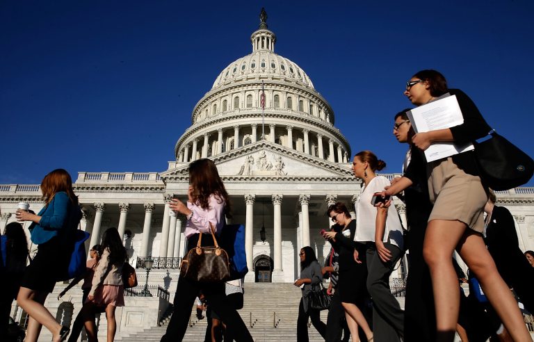 Tourists walk past the U.S. Capitol September 30, 2013 in Washington, DC. (Photo by Win McNamee/Getty Images)