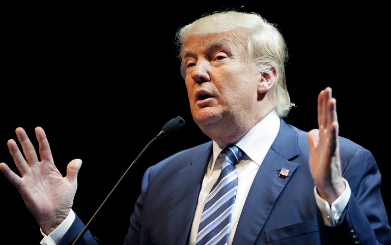 Rather than deflect or disagree with Hillary Clinton, Trump said that he is seeking an enormous tax cut. (AP Photo/Charlie Neibergall)