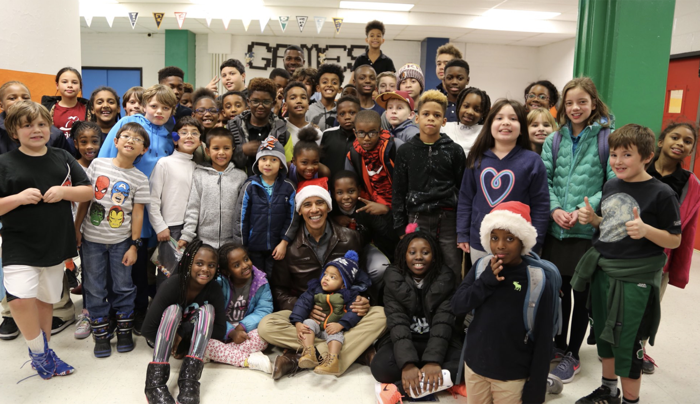 Obama dons Santa hat, visits Boys and Girls Club in DC
