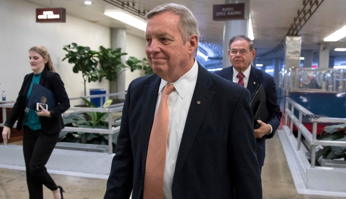 "What we're trying to do is find a solution to a shutdown, which we believe is a Trump shutdown. You've heard it over and over," Durbin said. (AP Photo/J. Scott Applewhite)