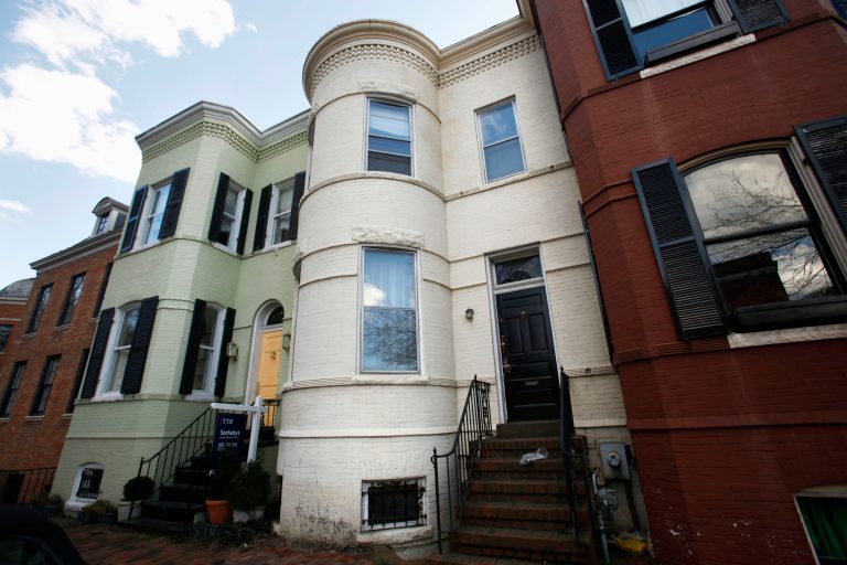 The tan rowhouse was home to Albrecht Muth, 47, and Viola Drath, 91, a German journalist and socialite, in the Georgetown neighborhood of Washington. Muth, 48, is charged with first-degree murder in Drath's death. (AP Photo/Jacquelyn Martin)