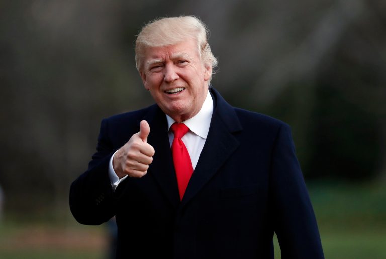 President Donald Trump gives a thumbs up as he walks to the White House after arriving on Marine One, Sunday, March 19, 2017, in Washington. Trump is returning from a trip to his Mar-a-Lago estate in Palm Beach, Fla. (AP Photo/Alex Brandon)