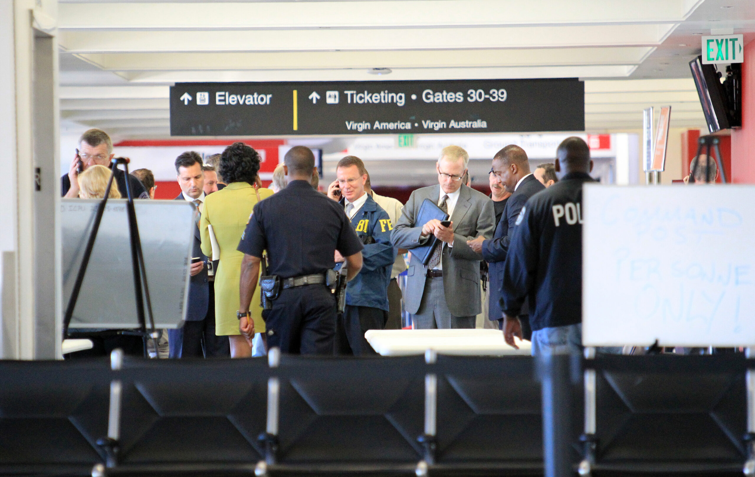 AP Exclusive: LAX gunfire came while officers away
