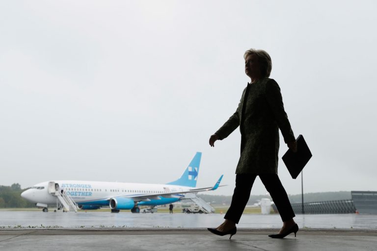 Democratic presidential candidate Hillary Clinton walks to a podium to speak with members of the media at Westchester County Airport in White Plains, N.Y., Monday, Sept. 19, 2016. (AP Photo/Matt Rourke)