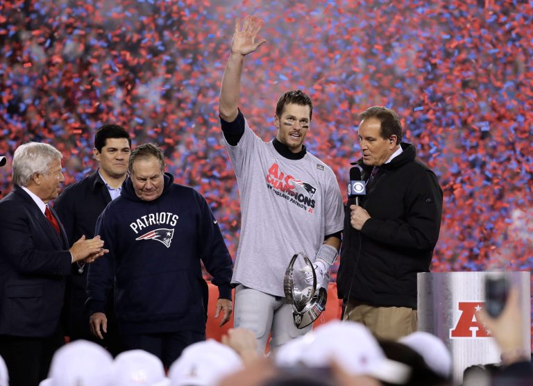 New England Patriots quarterback Tom Brady, second from right holding the AFC championship trophy, beside team owner Robert Kraft, left, honorary captain Tedy Bruschi, second from left, and head coach Bill Belichick after the AFC championship NFL football game, Sunday, Jan. 22, 2017, in Foxborough, Mass. (AP Photo/Matt Slocum)