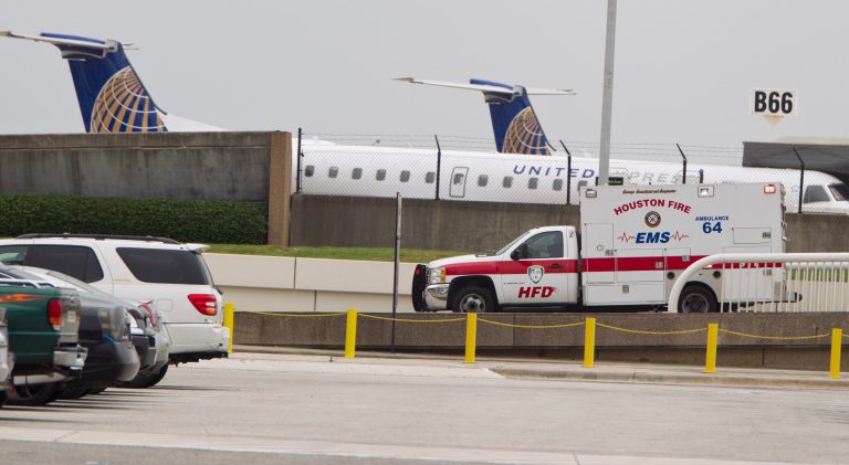 An EMS ambulance pulls out of of Terminal B at Bush Intercontinental Airport on Thursday, May 2, 2013 in Houston. Shots were fired near a ticket counter, critically injuring one armed man and sending people in the terminal scrambling and screaming, a Houston police spokesman and witnesses said. One person has been taken to an area hospital with life threatening injuries. It was not immediately clear who fired the shots. (AP Photo/Houston Chronicle, Karen Warren ) MANDATORY CREDIT