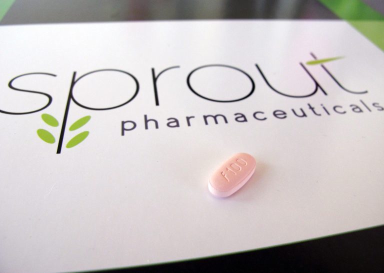 A tablet of flibanserin sits on a brochure for Sprout Pharmaceuticals.Â Valeant Pharmaceuticals will acquire Sprout Pharmaceuticals for about $1 billion.Â (AP Photo/Allen G. Breed)