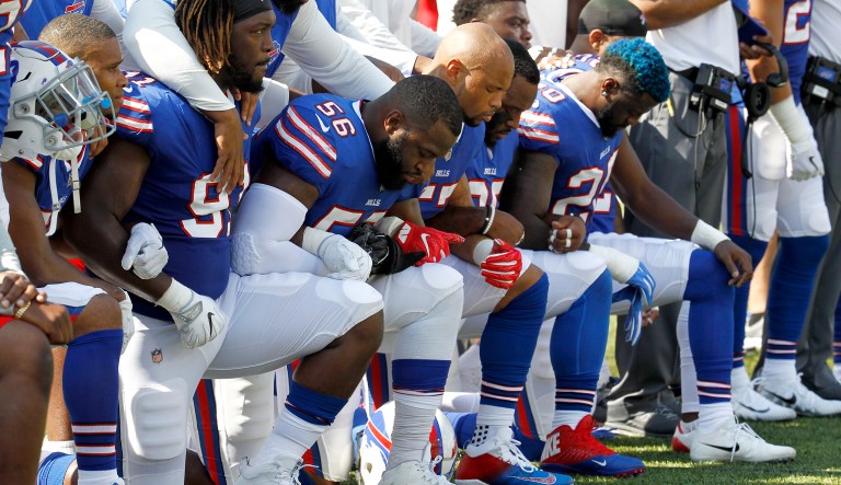 Buffalo Bills players kneel during the national anthem prior to an NFL football game against the Denver Broncos, Sunday, Sept. 24, 2017, in Orchard Park, N.Y. (AP Photo/Jeffrey T. Barnes)