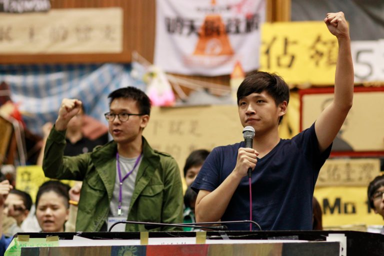 Lin Fei-fan, left, and Chen Wei-ting, leaders of the student protests against a trade pact with China, speak to the media during a press conference on the occupied legislature floor in Taipei, Taiwan, Monday, April 7, 2014. During a press conference Monday night, student leaders said they would end their 3-week-old occupation of the legislature but continue to protest against a trade pact with China, which has been challenging the president's policy of moving the democratic island economically closer to China. (AP Photo/Wally Santana)