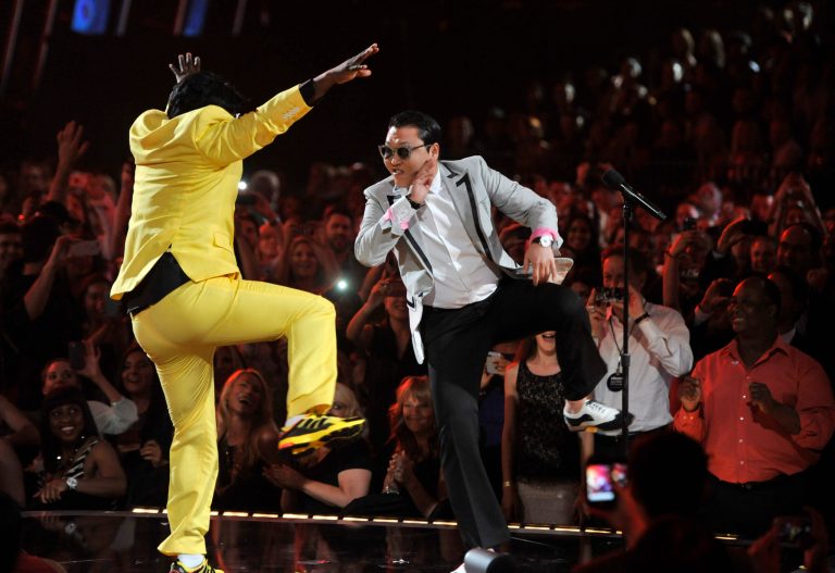 Tracy Morgan, left, and Psy participate in a 