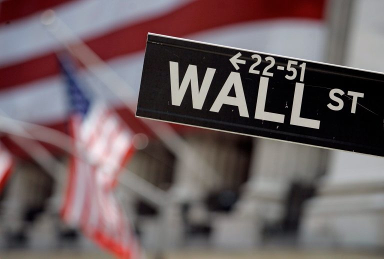 FILE - In this May 11, 2007, file photo, a Wall Street sign is mounted near the flag-draped facade of the New York Stock Exchange. Stocks are heading lower in early trading Wednesday, Oct. 1, 2014, putting the market on course for its third loss in a row. (AP Photo/Richard Drew, File)