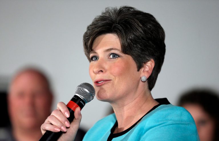 The first ad slams Joni Ernst for signing the Americans for Tax Reform pledge to refuse raising taxes. (AP Photo)