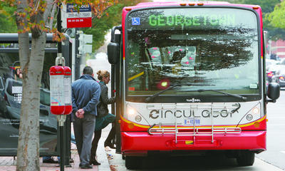 D.C. is weighing privatizing city buses -- including Metrobus and the D.C. Circulator -- and a proposed streetcar system. (Examiner file photo)