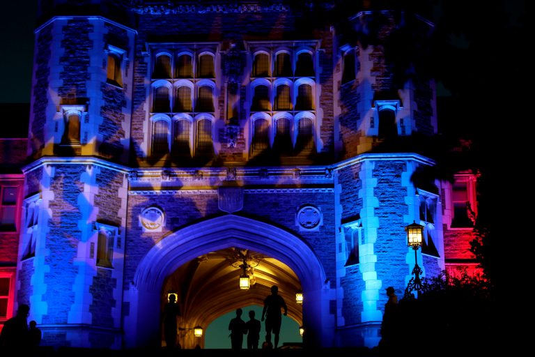 Brookings Hall is lit up in a patriotic theme as preparations continue ahead of the second presidential debate at Washington University in St. Louis, Thursday, Oct. 6, 2016. The town hall debate between Republican presidential nominee Donald Trump and Democratic presidential nominee Hillary Clinton is set for this Sunday. (AP Photo/Jeff Roberson)