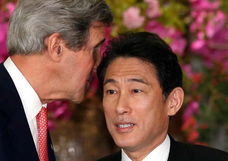U.S. Secretary of Sate John Kerry, left, whispers to Japanese Foreign Minister Fumio Kishida after their joint press conference at Foreign Ministry's Iikura Guesthouse in Tokyo, Sunday, April 14, 2013. Kerry and Kishida said their countries are committed to new talks with North Korea if the reclusive communist government begins abiding by previous agreements on its nuclear program. (AP Photo/Shizuo Kambayashi)